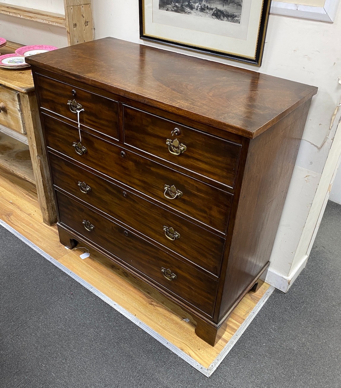 A George III mahogany chest of two short and three graduating long drawers, width 108cm, depth 51cm, height 106cm